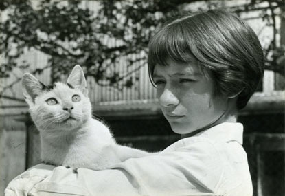 archive black and white photo of child holding a cat