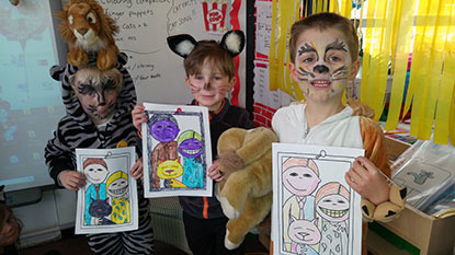 school boys dressed as cats with drawings
