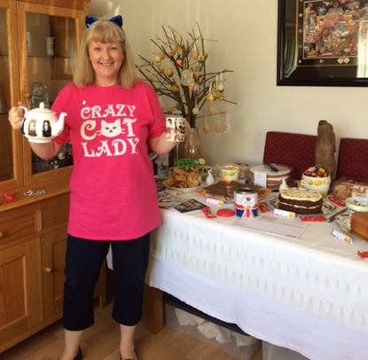 woman in crazy cat t-shirt cake sale spread