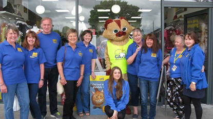 Cats Protection staff and volunteers outside a charity shop