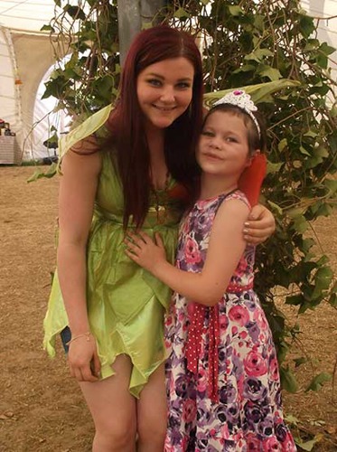 woman and young girl dressed as fairies in a marquee
