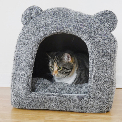 grey igloo cat bed with bear ears with tabby cat inside